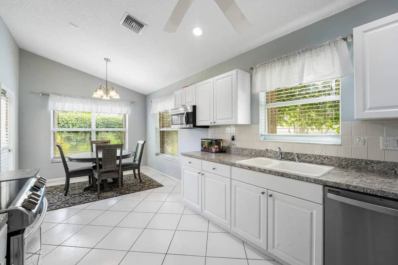 Kitchen at 3907 Palladium View Drive with granite counters, stainless appliances and an adjoining breakfast area