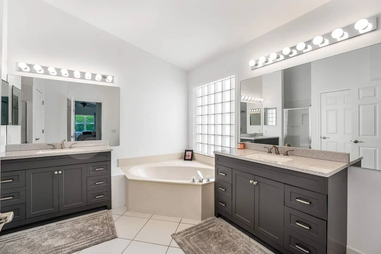 Primary bathroom at 3907 Palladium View Drive with dual vanities, soaking tub and separate shower